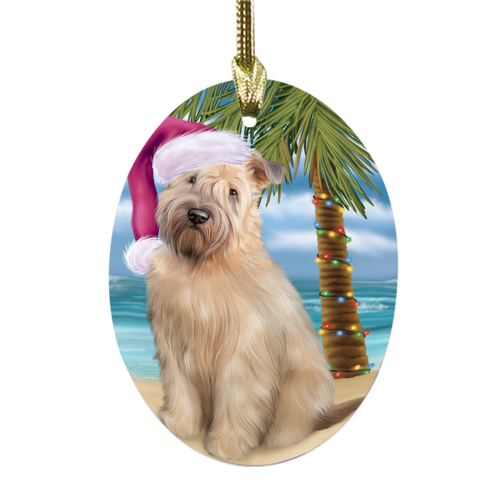 Summertime Happy Holidays Christmas Wheaten Terrier Dog on Tropical Island Beach Oval Glass Christmas Ornament OGOR49406