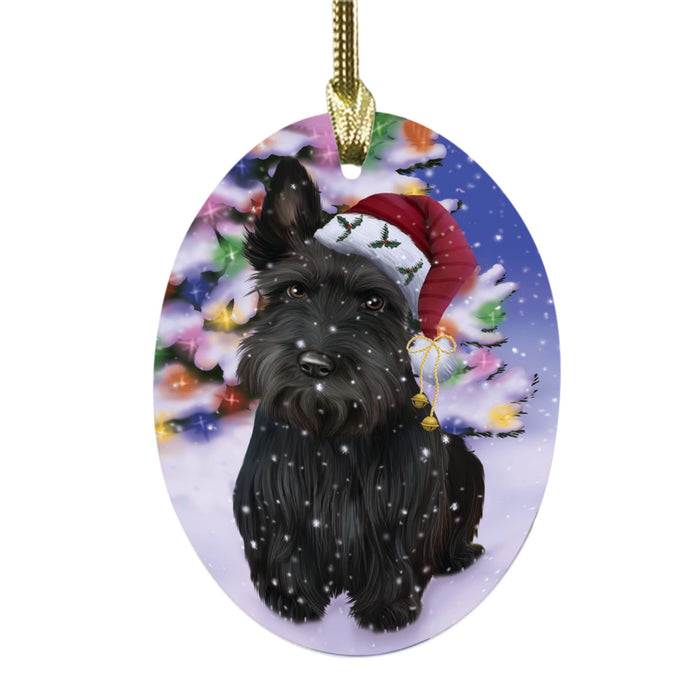 Winterland Wonderland Scottish Terrier Dog In Christmas Holiday Scenic Background Oval Glass Christmas Ornament OGOR49634