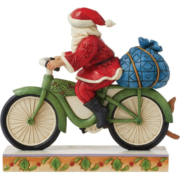 Enesco Jim Shore Heartwood Creek Santa Riding Bicycle Figurine, 7.09"