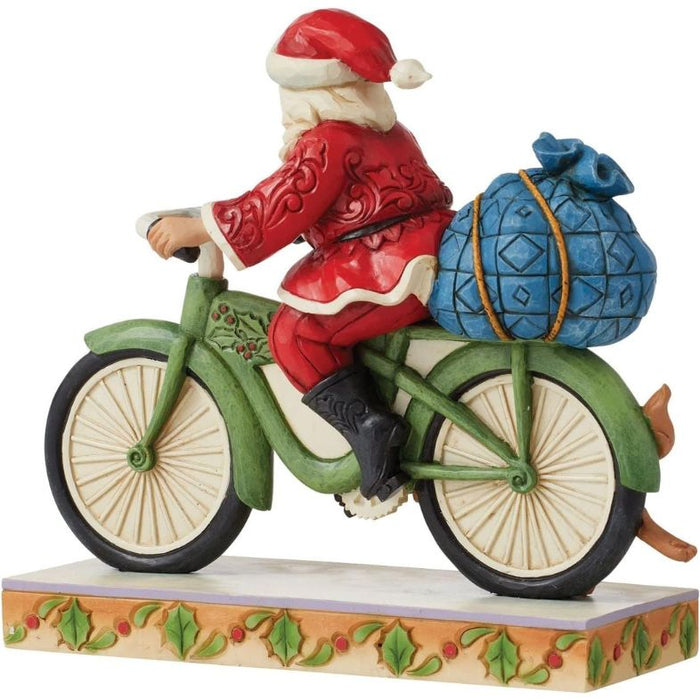 Enesco Jim Shore Heartwood Creek Santa Riding Bicycle Figurine, 7.09"