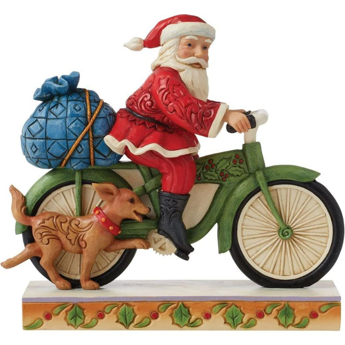 Enesco Jim Shore Heartwood Creek Santa Riding Bicycle Figurine, 7.09"