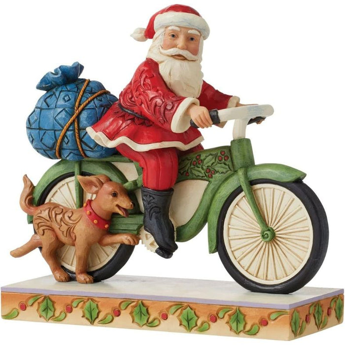 Enesco Jim Shore Heartwood Creek Santa Riding Bicycle Figurine, 7.09"