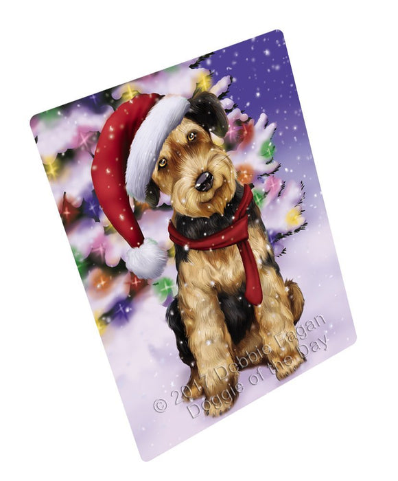 Winterland Wonderland Airedales Puppy Dog In Christmas Holiday Scenic Background Tempered Cutting Board