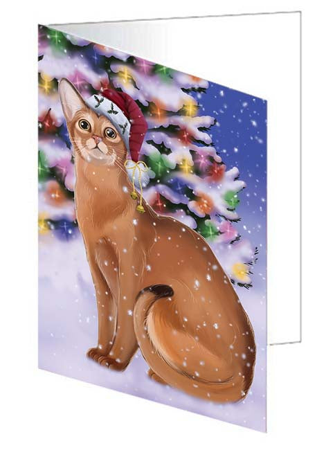 Winterland Wonderland Abyssinian Cat In Christmas Holiday Scenic Background Handmade Artwork Assorted Pets Greeting Cards and Note Cards with Envelopes for All Occasions and Holiday Seasons GCD71537