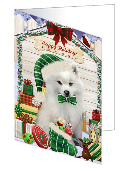 Happy Holidays Christmas American Eskimo Dog House with Presents Handmade Artwork Assorted Pets Greeting Cards and Note Cards with Envelopes for All Occasions and Holiday Seasons GCD57941