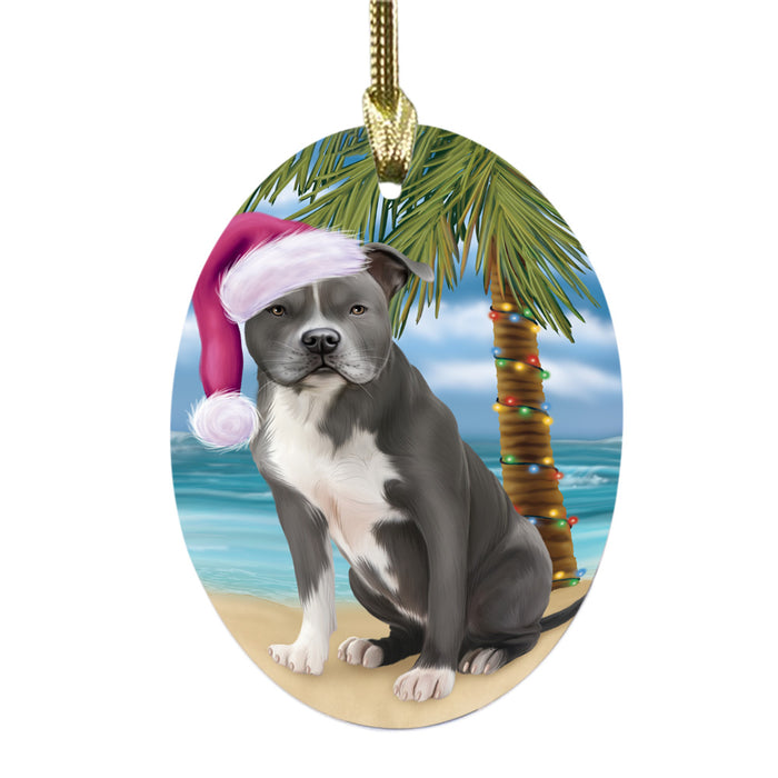 Summertime Happy Holidays Christmas American Staffordshire Dog on Tropical Island Beach Oval Glass Christmas Ornament OGOR49339