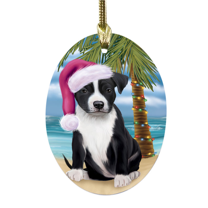 Summertime Happy Holidays Christmas American Staffordshire Dog on Tropical Island Beach Oval Glass Christmas Ornament OGOR49340