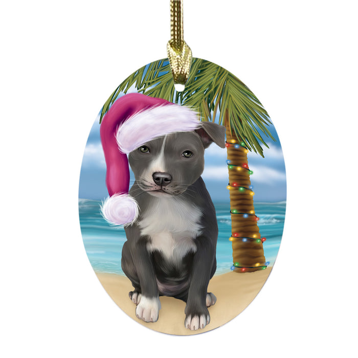 Summertime Happy Holidays Christmas American Staffordshire Dog on Tropical Island Beach Oval Glass Christmas Ornament OGOR49342