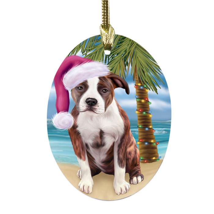 Summertime Happy Holidays Christmas American Staffordshire Dog on Tropical Island Beach Oval Glass Christmas Ornament OGOR49343