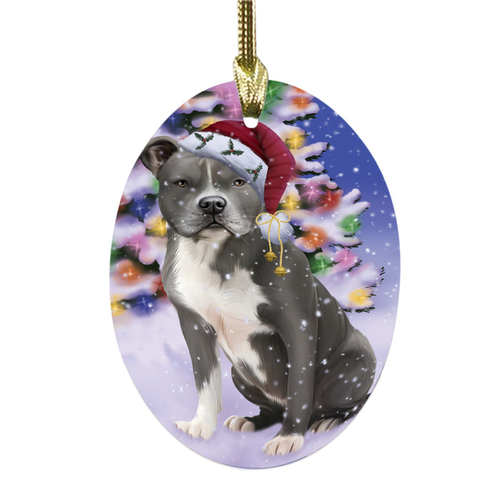 Winterland Wonderland American Staffordshire Dog In Christmas Holiday Scenic Background Oval Glass Christmas Ornament OGOR49488