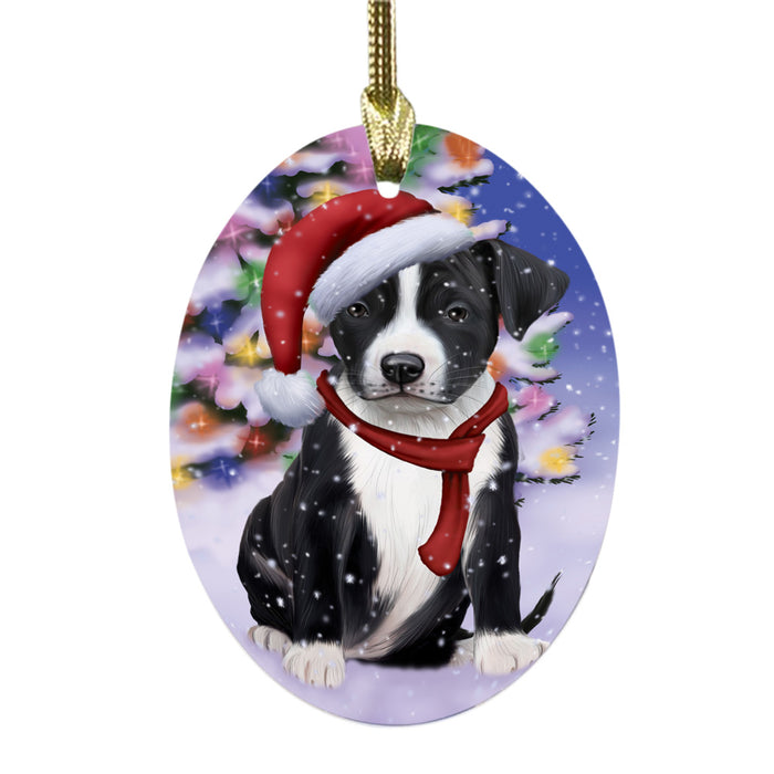 Winterland Wonderland American Staffordshire Dog In Christmas Holiday Scenic Background Oval Glass Christmas Ornament OGOR49489