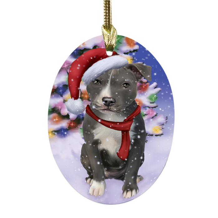 Winterland Wonderland American Staffordshire Dog In Christmas Holiday Scenic Background Oval Glass Christmas Ornament OGOR49491