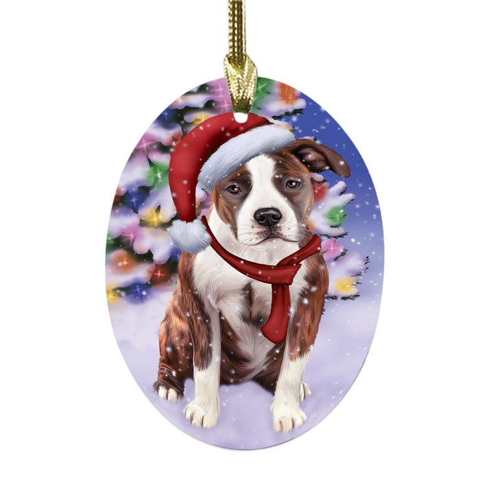 Winterland Wonderland American Staffordshire Dog In Christmas Holiday Scenic Background Oval Glass Christmas Ornament OGOR49492