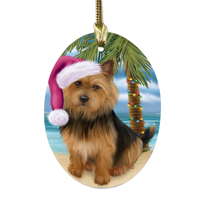 Summertime Happy Holidays Christmas Australian Terrier Dog on Tropical Island Beach Oval Glass Christmas Ornament OGOR49344