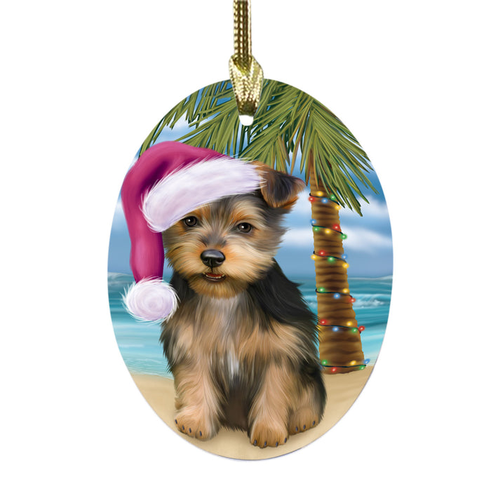 Summertime Happy Holidays Christmas Australian Terrier Dog on Tropical Island Beach Oval Glass Christmas Ornament OGOR49346