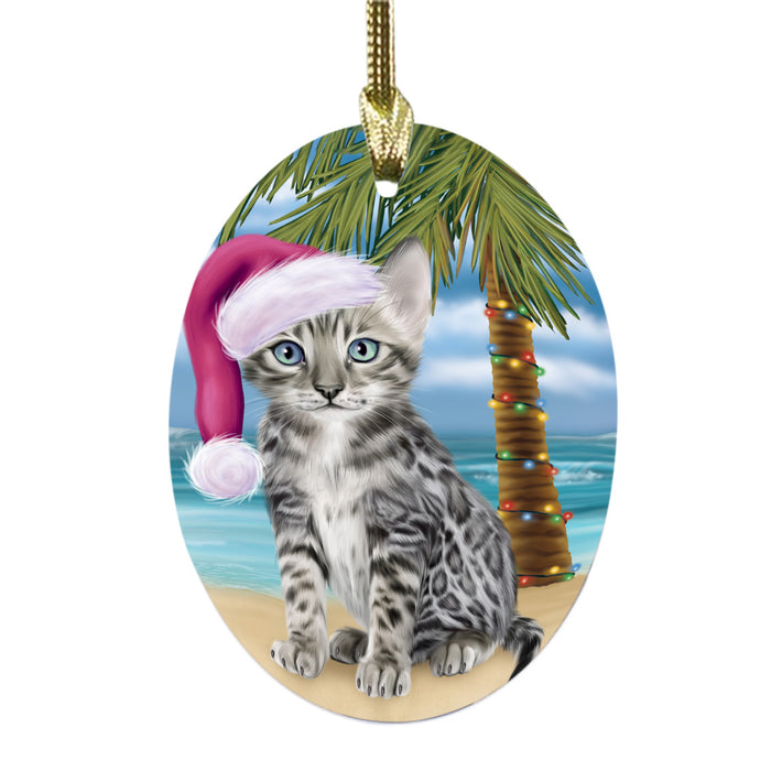 Summertime Happy Holidays Christmas Bengal Cat on Tropical Island Beach Oval Glass Christmas Ornament OGOR49349