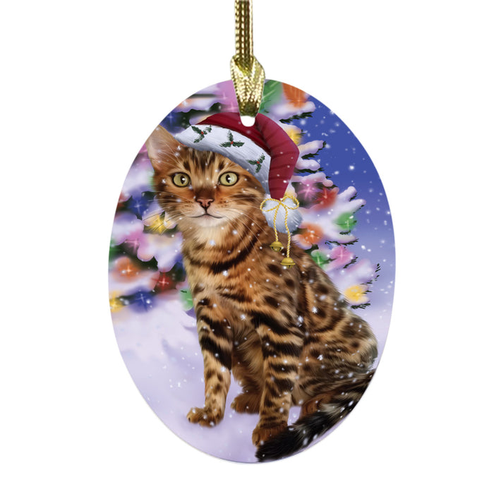 Winterland Wonderland Bengal Cat In Christmas Holiday Scenic Background Oval Glass Christmas Ornament OGOR49512