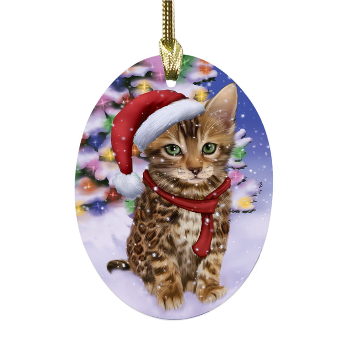 Winterland Wonderland Bengal Cat In Christmas Holiday Scenic Background Oval Glass Christmas Ornament OGOR49513
