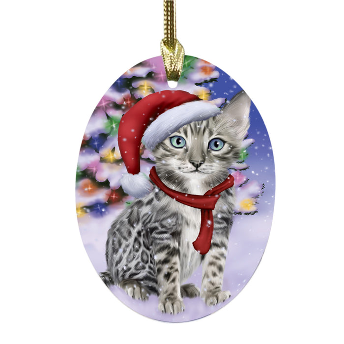 Winterland Wonderland Bengal Cat In Christmas Holiday Scenic Background Oval Glass Christmas Ornament OGOR49514