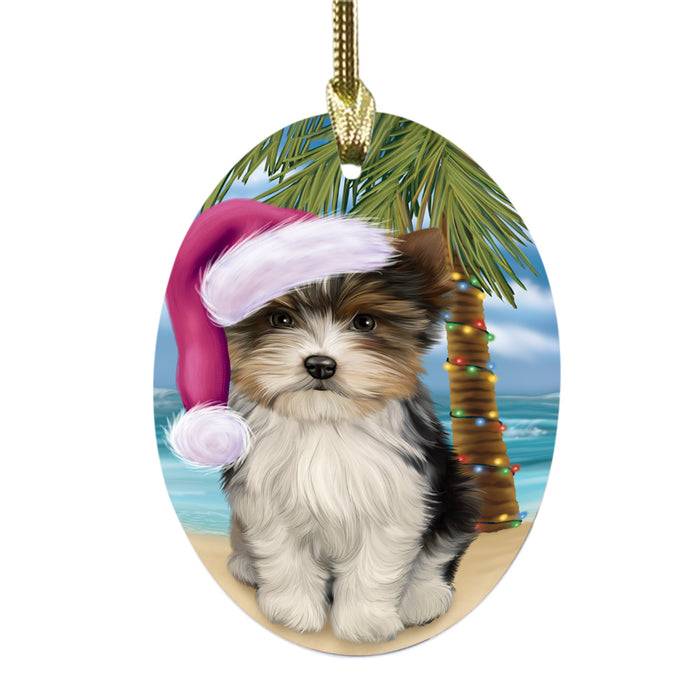 Summertime Happy Holidays Christmas Biewer Dog on Tropical Island Beach Oval Glass Christmas Ornament OGOR49352