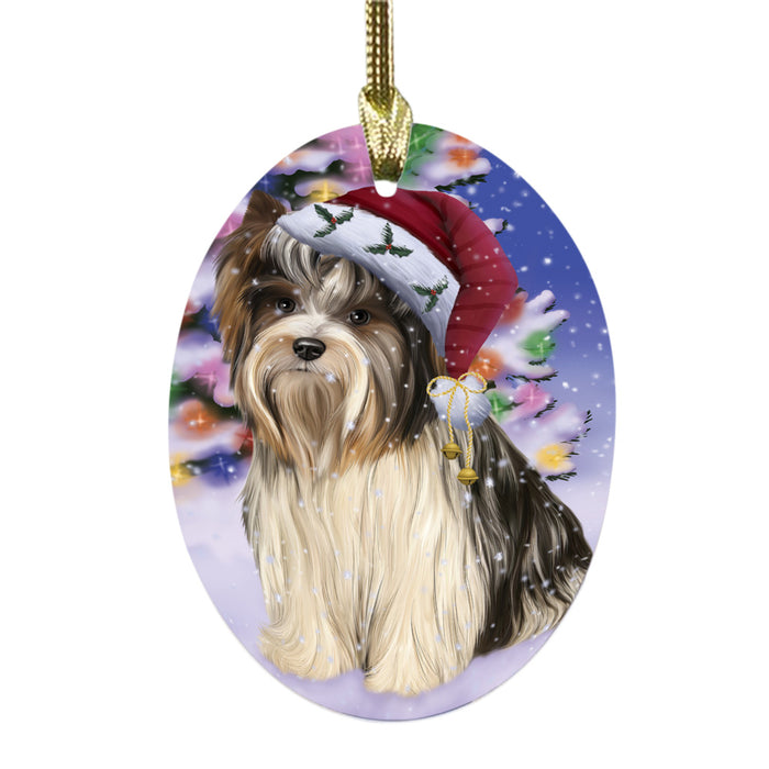 Winterland Wonderland Biewer Dog In Christmas Holiday Scenic Background Oval Glass Christmas Ornament OGOR49522