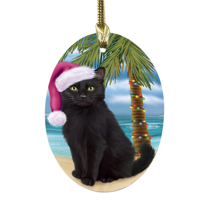 Summertime Happy Holidays Christmas Black Cat on Tropical Island Beach Oval Glass Christmas Ornament OGOR49353