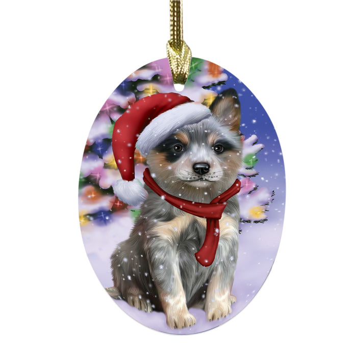 Winterland Wonderland Blue Heeler Dog In Christmas Holiday Scenic Background Oval Glass Christmas Ornament OGOR49528