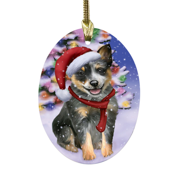 Winterland Wonderland Blue Heeler Dog In Christmas Holiday Scenic Background Oval Glass Christmas Ornament OGOR49529