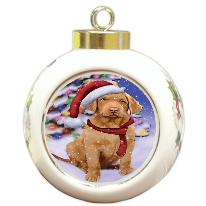 Winterland Wonderland Chesapeake Bay Retriever Dog In Christmas Holiday Scenic Background  Round Ball Christmas Ornament RBPOR53379