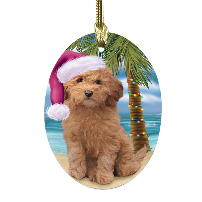 Summertime Happy Holidays Christmas Goldendoodle Dog on Tropical Island Beach Oval Glass Christmas Ornament OGOR49372