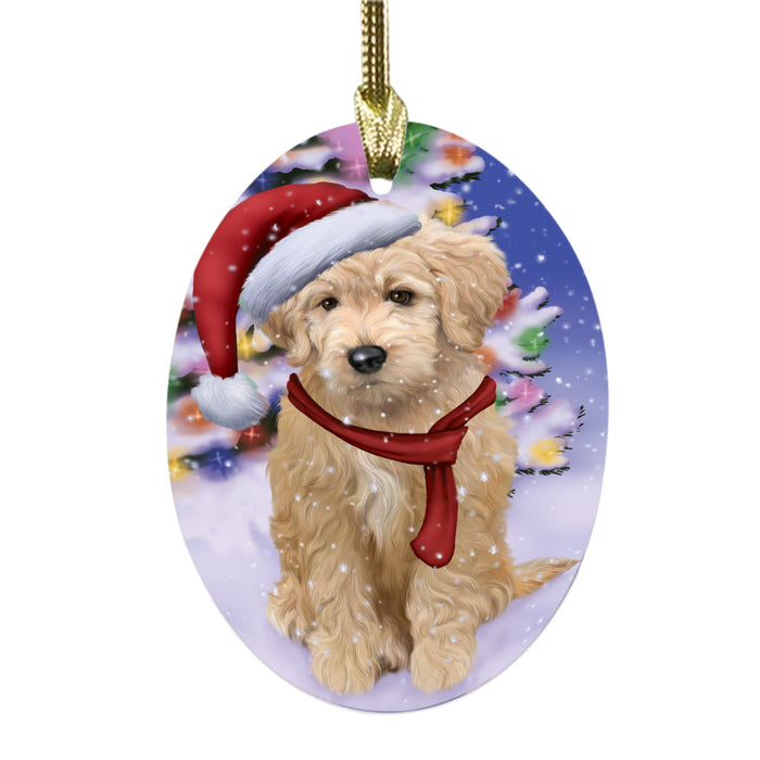 Winterland Wonderland Goldendoodle Dog In Christmas Holiday Scenic Background Oval Glass Christmas Ornament OGOR49579