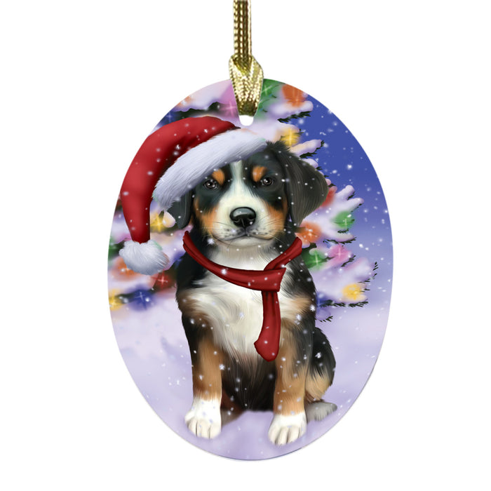 Winterland Wonderland Greater Swiss Mountain Dog In Christmas Holiday Scenic Background Oval Glass Christmas Ornament OGOR49587