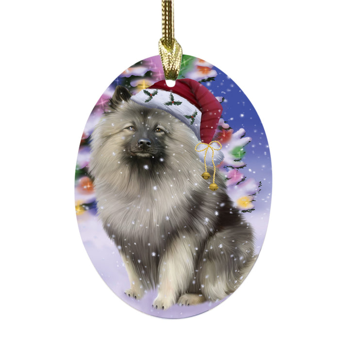 Winterland Wonderland Keeshond Dog In Christmas Holiday Scenic Background Oval Glass Christmas Ornament OGOR49594