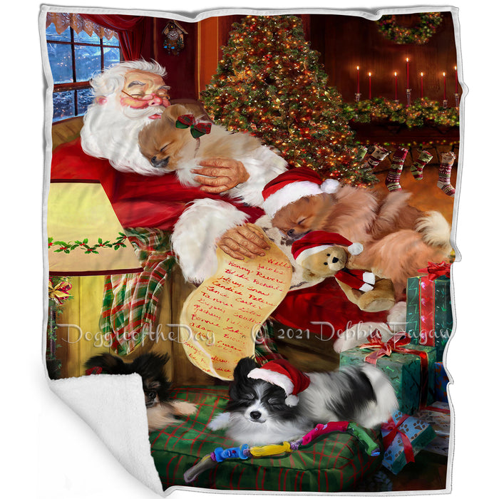 Pomeranian Dog and Puppies Sleeping with Santa Blanket
