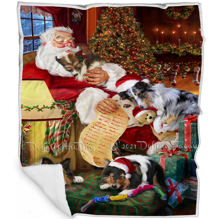 Sheltie Dog and Puppies Sleeping with Santa Blanket