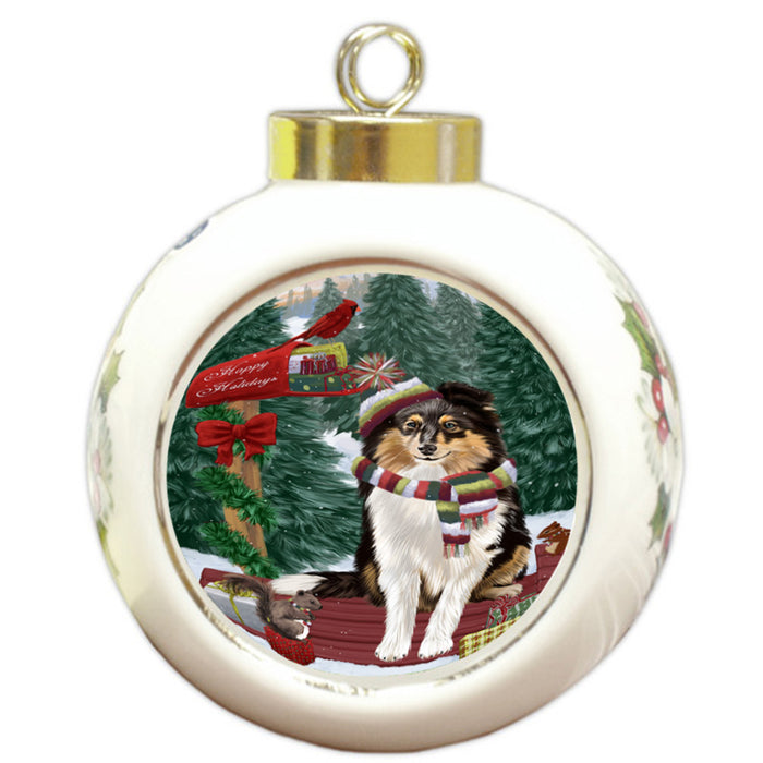Merry Christmas Woodland Sled Shetland Sheepdog Round Ball Christmas Ornament RBPOR55388