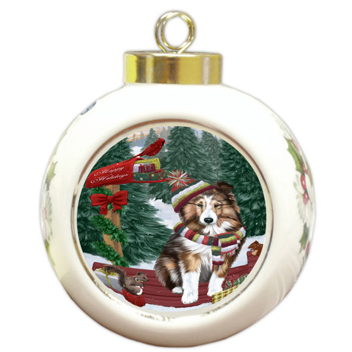 Merry Christmas Woodland Sled Shetland Sheepdog Round Ball Christmas Ornament RBPOR55389