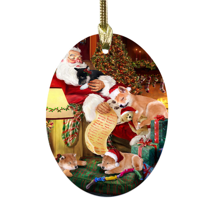 Shiba Inus Dog and Puppies Sleeping with Santa Oval Glass Christmas Ornament OGOR49318
