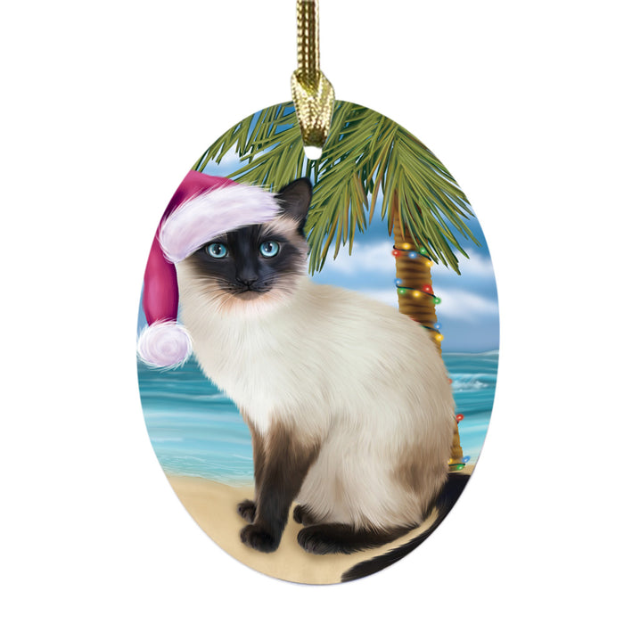 Summertime Happy Holidays Christmas Siamese Cat on Tropical Island Beach Oval Glass Christmas Ornament OGOR49392