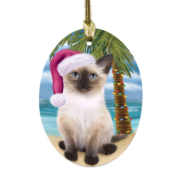 Summertime Happy Holidays Christmas Siamese Cat on Tropical Island Beach Oval Glass Christmas Ornament OGOR49393