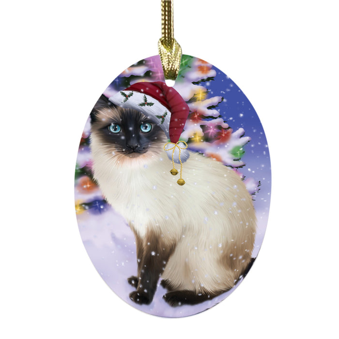 Winterland Wonderland Siamese Cat In Christmas Holiday Scenic Background Oval Glass Christmas Ornament OGOR49640