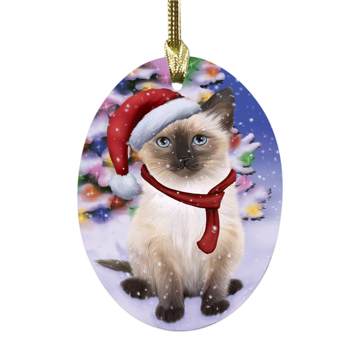 Winterland Wonderland Siamese Cat In Christmas Holiday Scenic Background Oval Glass Christmas Ornament OGOR49641