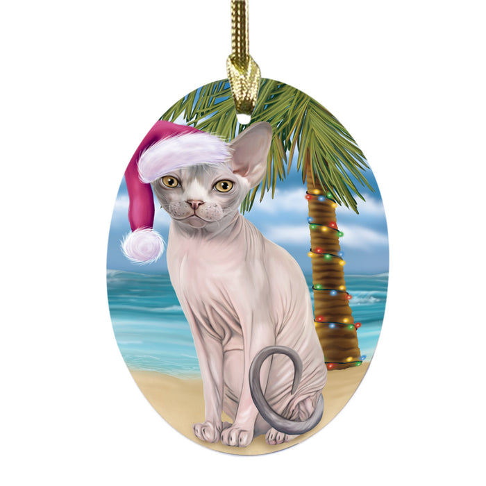 Summertime Happy Holidays Christmas Sphynx Cat on Tropical Island Beach Oval Glass Christmas Ornament OGOR49394
