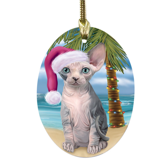 Summertime Happy Holidays Christmas Sphynx Cat on Tropical Island Beach Oval Glass Christmas Ornament OGOR49397