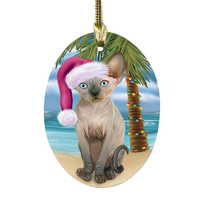 Summertime Happy Holidays Christmas Sphynx Cat on Tropical Island Beach Oval Glass Christmas Ornament OGOR49398