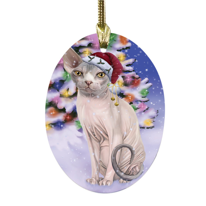Winterland Wonderland Sphynx Cat In Christmas Holiday Scenic Background Oval Glass Christmas Ornament OGOR49644