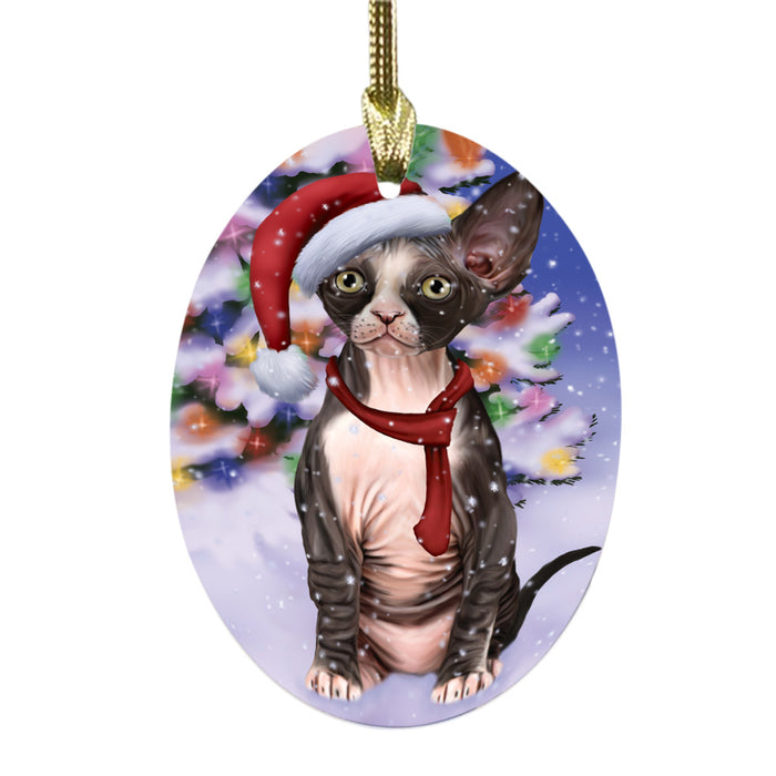Winterland Wonderland Sphynx Cat In Christmas Holiday Scenic Background Oval Glass Christmas Ornament OGOR49645
