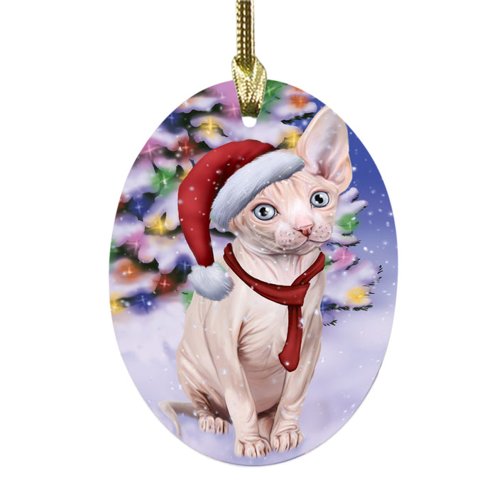 Winterland Wonderland Sphynx Cat In Christmas Holiday Scenic Background Oval Glass Christmas Ornament OGOR49646