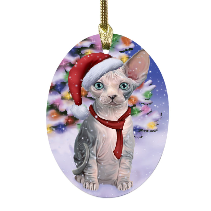 Winterland Wonderland Sphynx Cat In Christmas Holiday Scenic Background Oval Glass Christmas Ornament OGOR49647