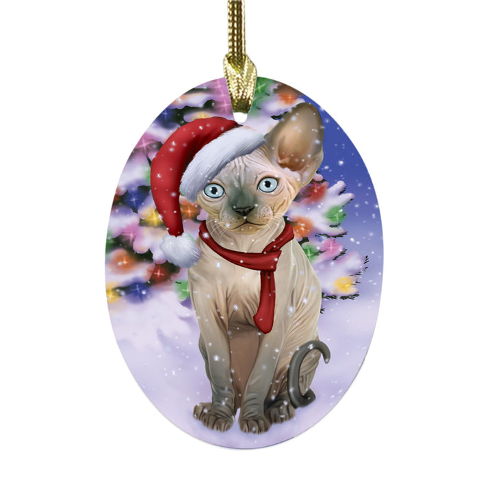 Winterland Wonderland Sphynx Cat In Christmas Holiday Scenic Background Oval Glass Christmas Ornament OGOR49648